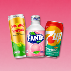 International soda cans Red Bull, Fanta, Dr Pepper on pink background