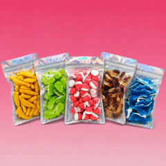 Colorful mix of assorted gummy candies including gummy eggs, rings, cherries, and animals