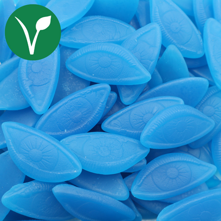 Pile of blue eye-shaped vegan candy with a vegan symbol in the corner