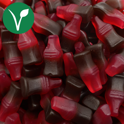 Vegan cherry cola bottle gummies, red and brown fruit candy mix, close-up view