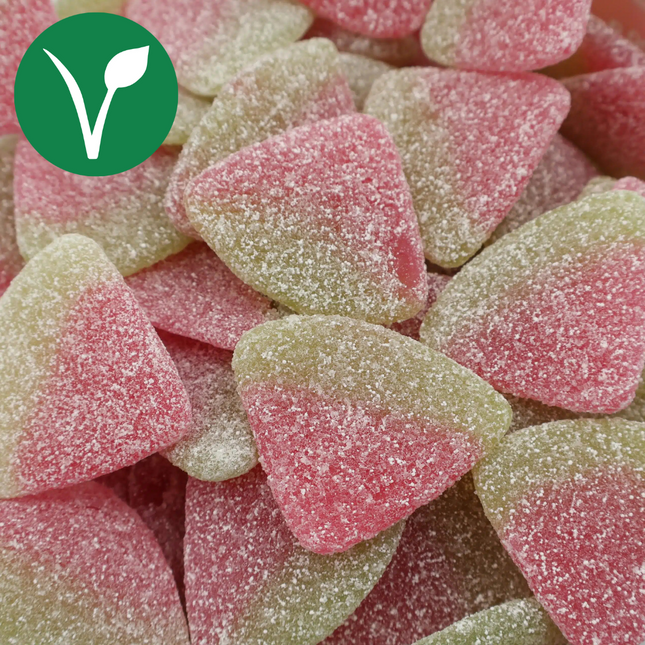 Vegan sour watermelon gummies coated in sugar, pink and green, close-up.