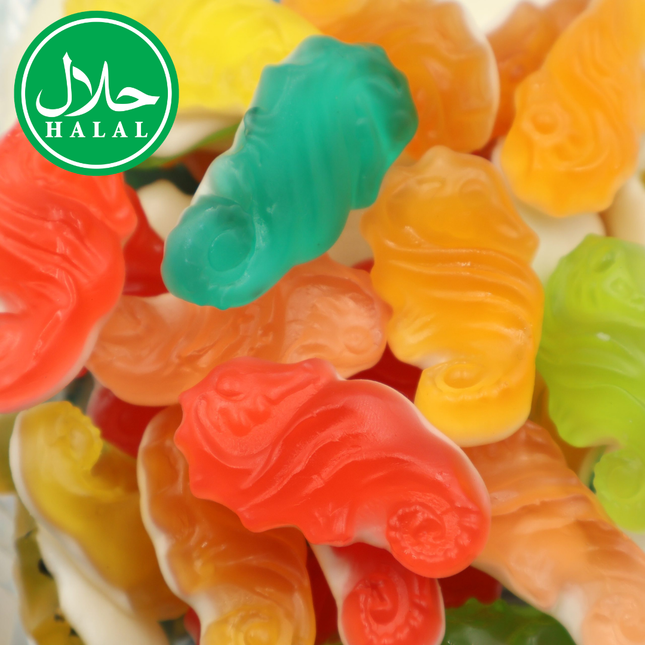 Colorful halal gummy candy shaped like seahorses piled together.