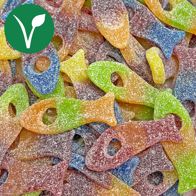 Colorful sour vegan gummy fish candies covered in sugar